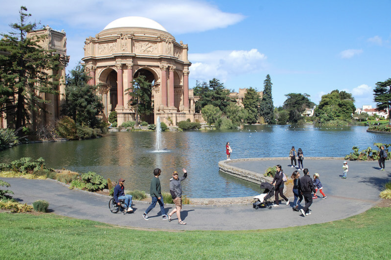 Wheelchair user and friends strolling pathways in San Francisco