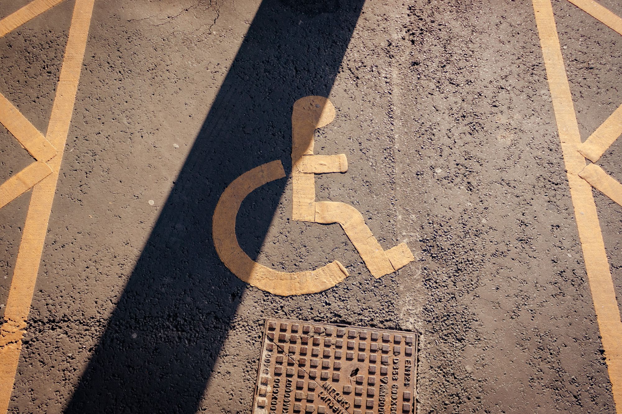 A parking spot that has the disability symbol 