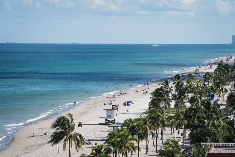 Hollywood beach features 8 Mobi-Mat wheelchair access mats providing easy access to the white sands at regular intervals along the paved walkway.