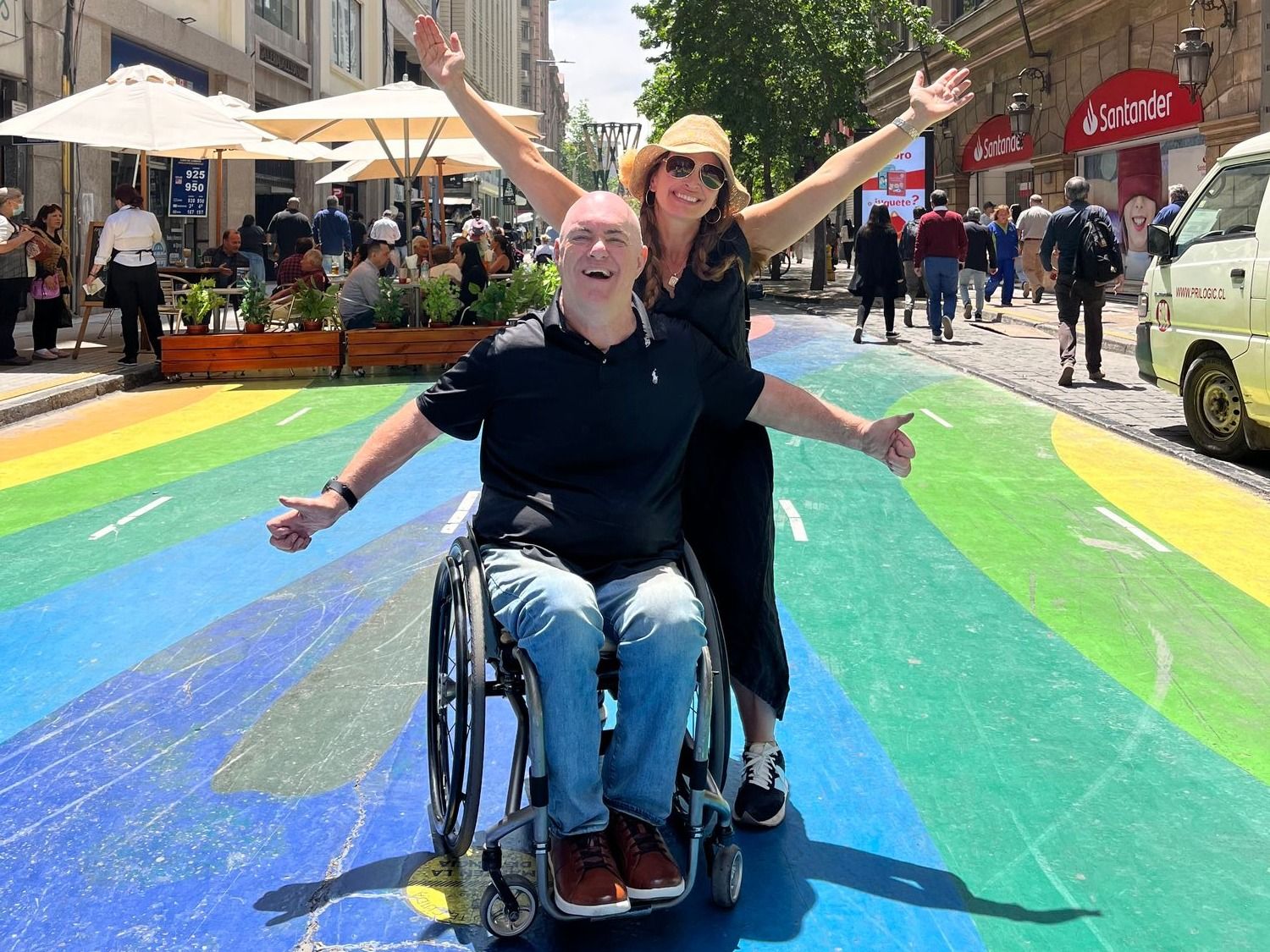 Disabled individual and companion enjoying their trip.