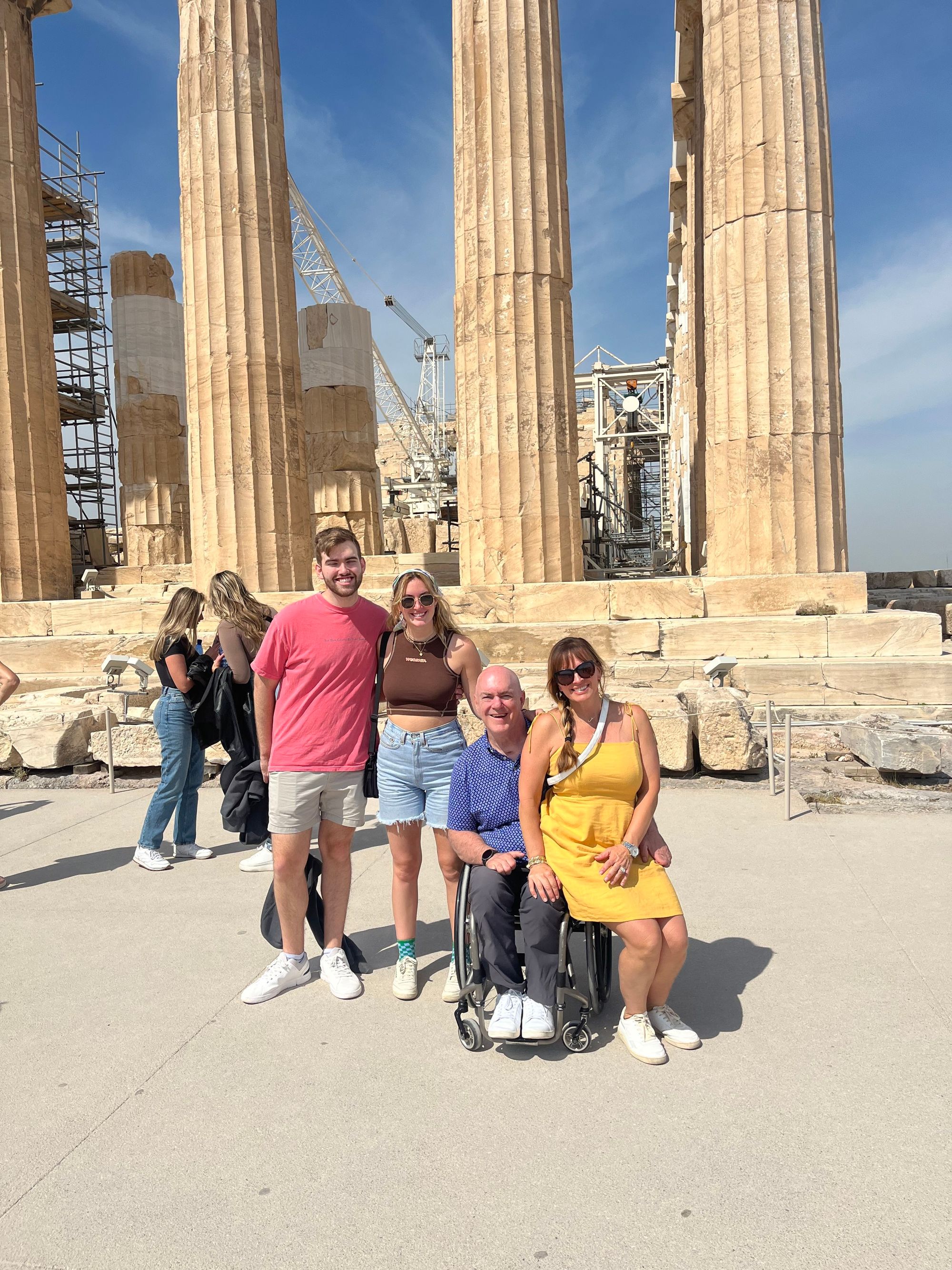 Wheelchair traveler and companions enjoying their trip.