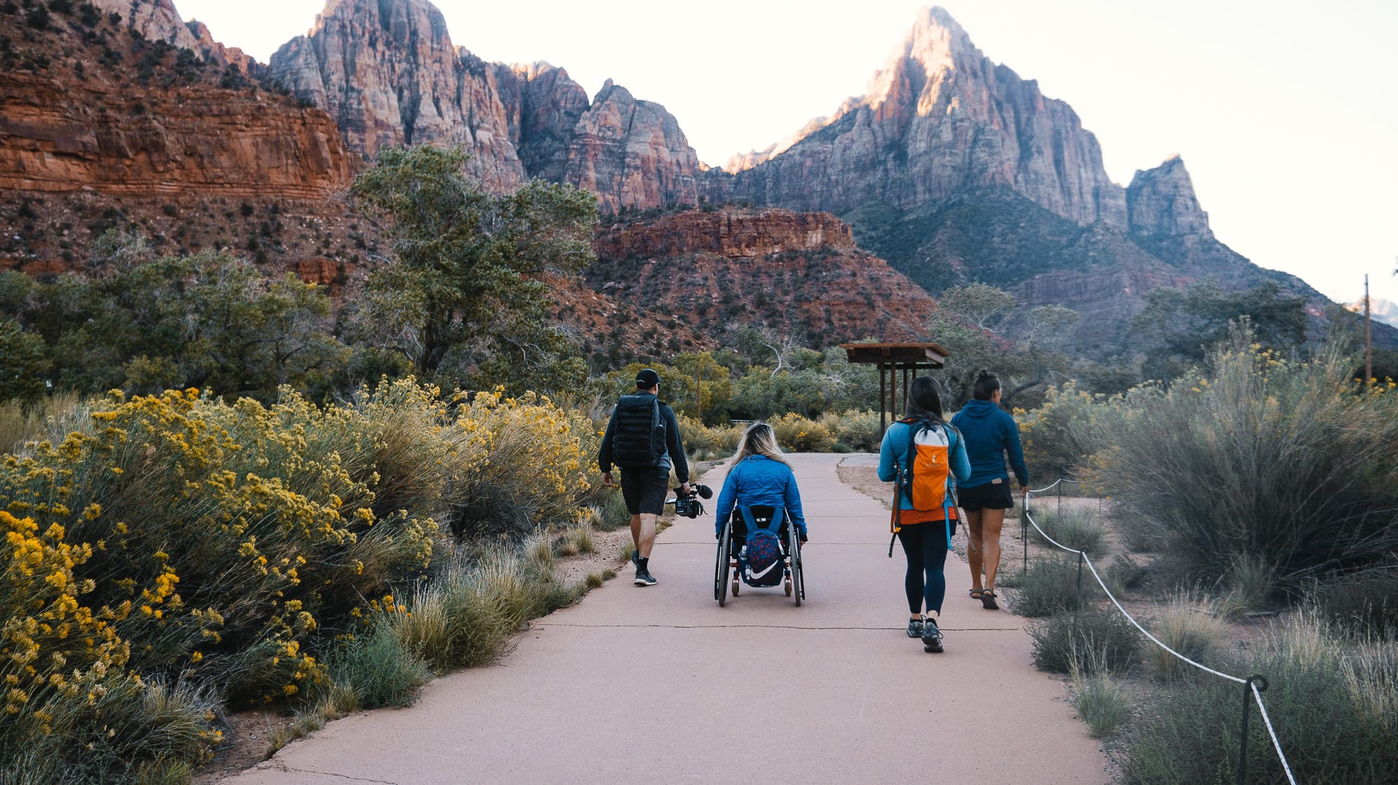 Wheelchair user enjoying accessible paths in Zion National Park. You can plan accessible trips here with Wheel the World