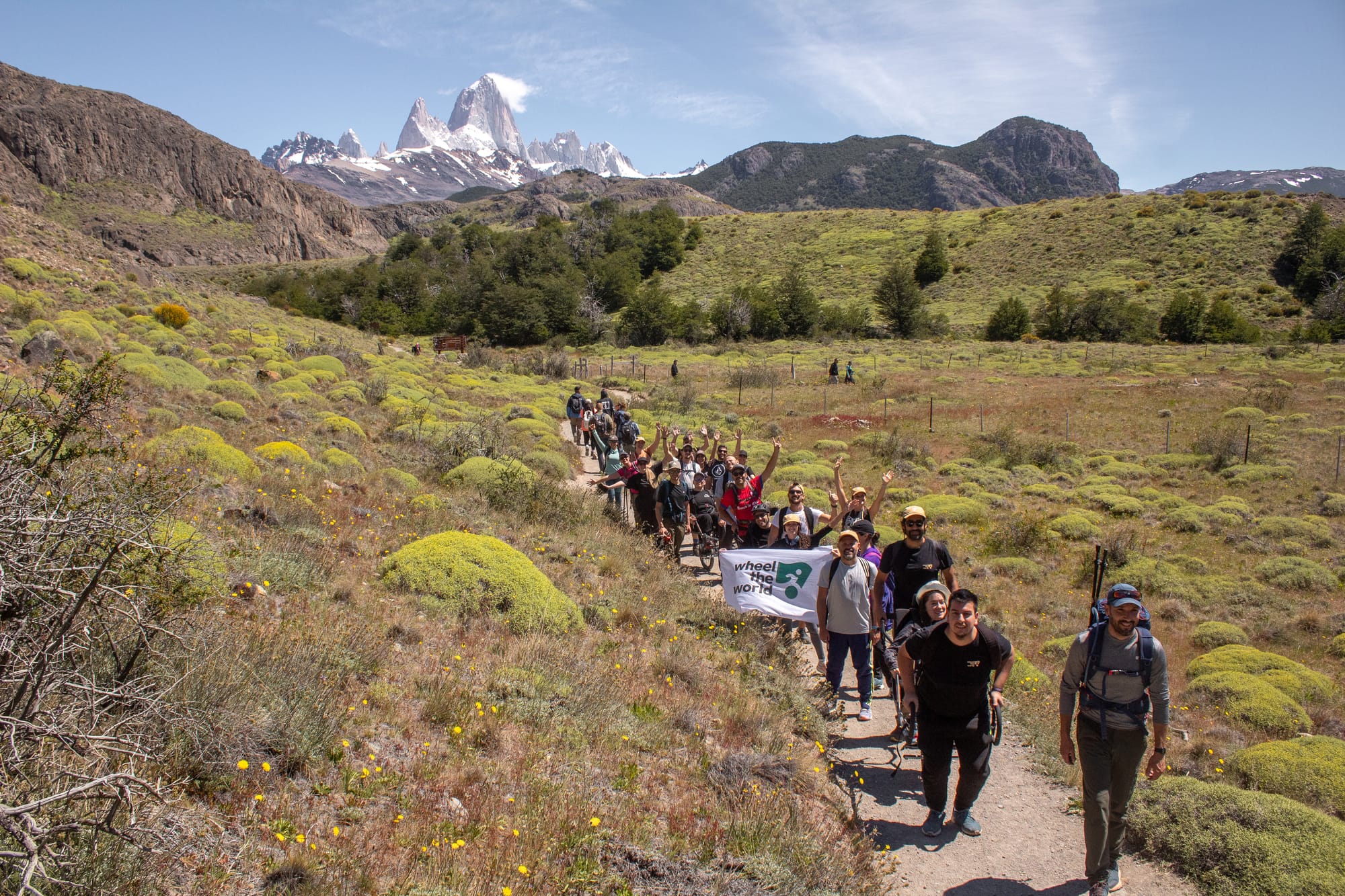The Wheel the World team hiking a trail in El Chaltén, Patagonia with 3 wheelchair-users