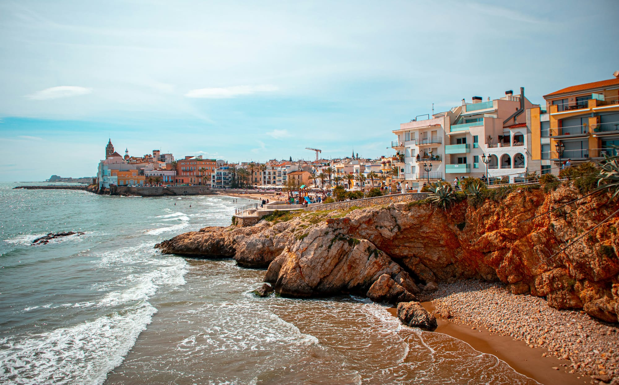 A beach and city view of Sitges
