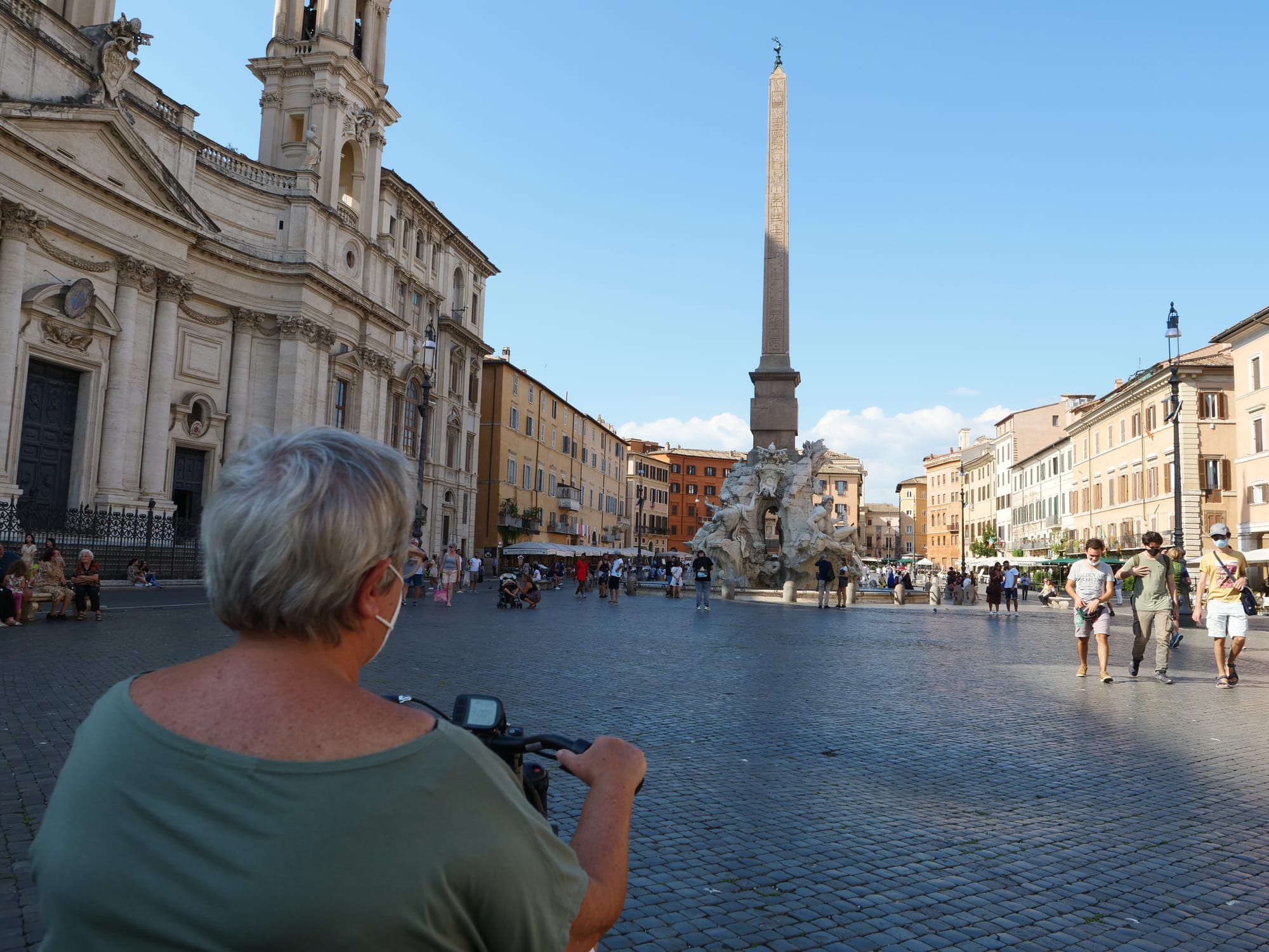 Wheelchair-user on cobblestone square in Rome