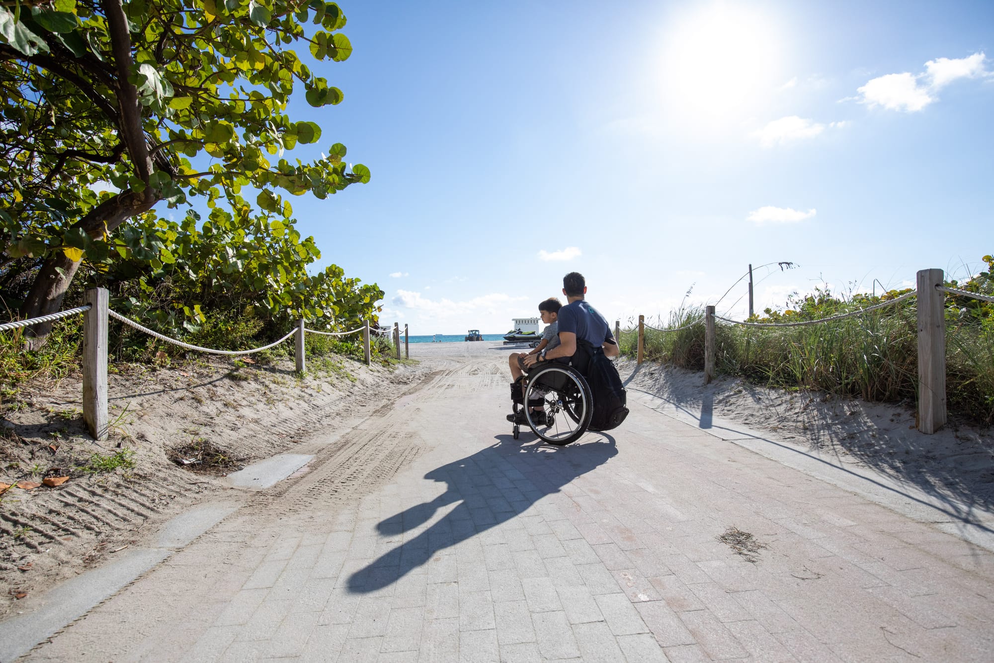 Wheelchair-user enjoying the beach in Miamii