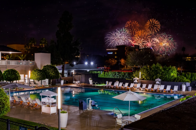 Accessible pool at the Anaheim Hotel with fireworks in the distance