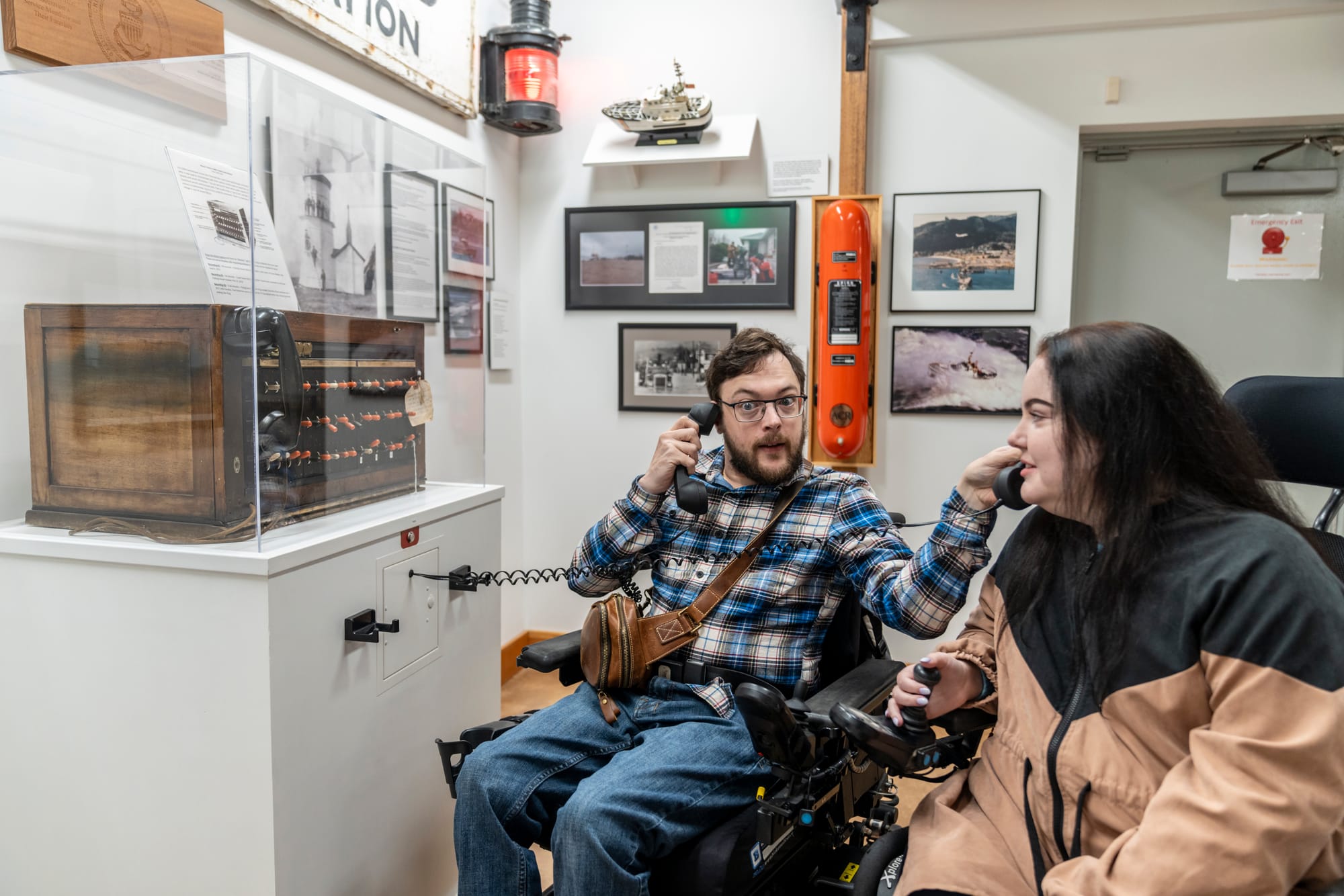 Two wheelchair users enjoying the Garibaldi Maritime Museum in Garibaldi, Oregon - an accessible activity on the Tillamook Coast 