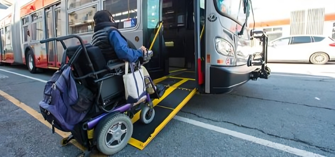 Wheelchair user accesses bus in San Francisco via ramp