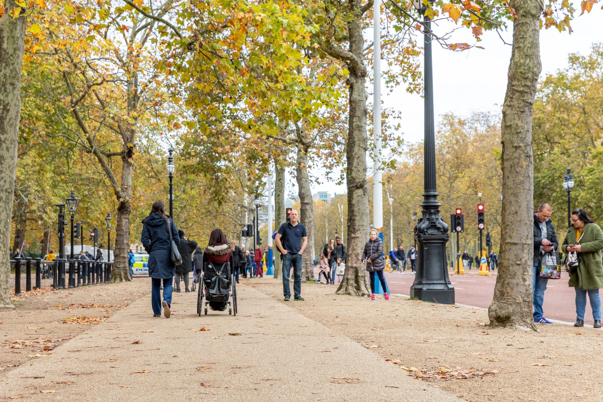 Wheelchair user and companion enjoy flat, accessible sidewalks in London