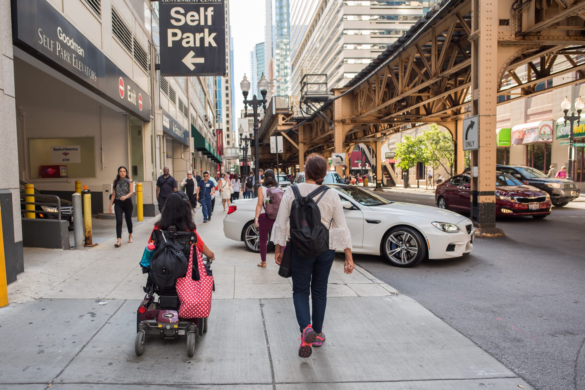 wheelchair user rolling the sidewalk in Chicago