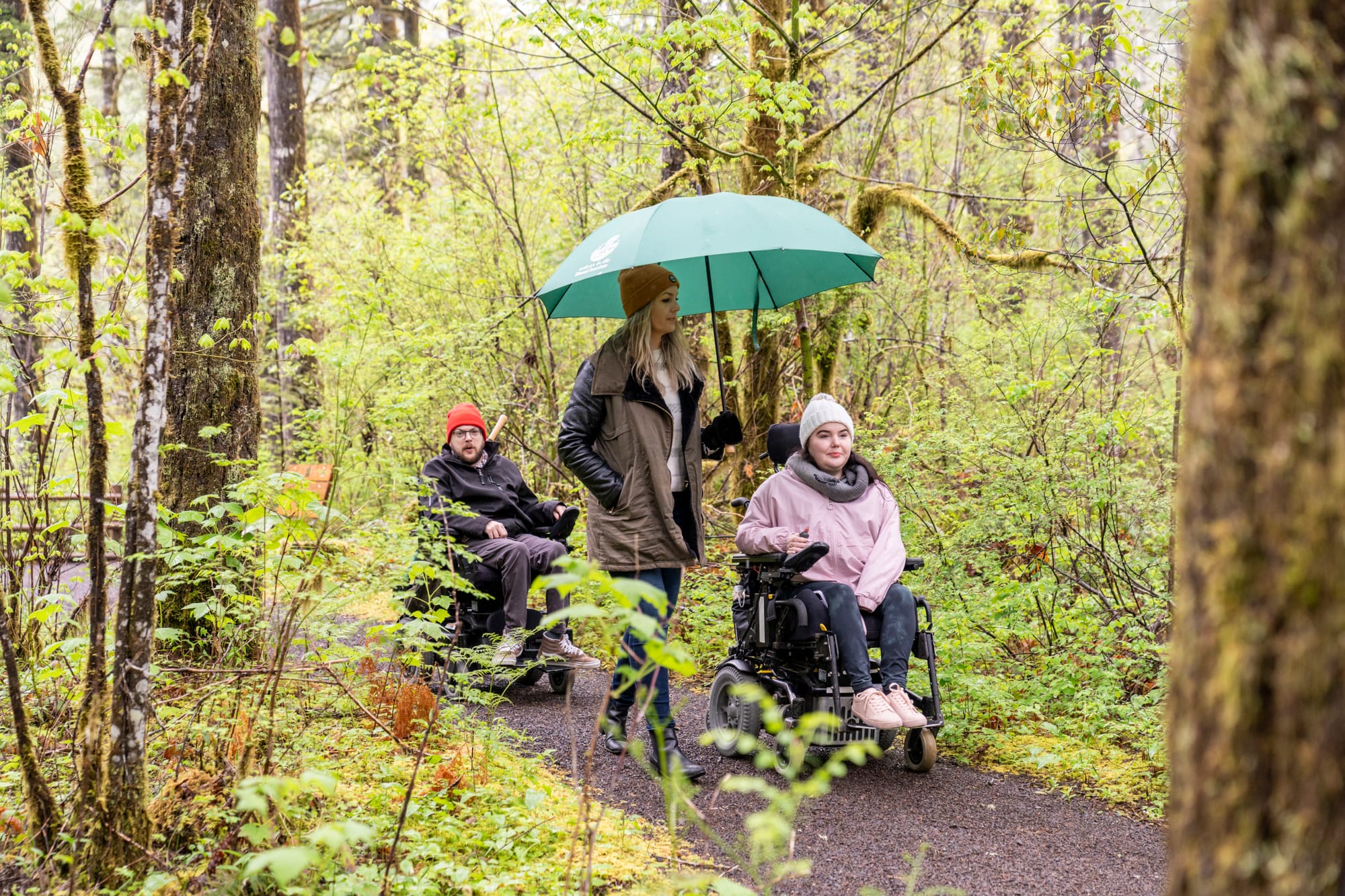 Two wheelchair users on accessible trails at Tillamook Forest Center