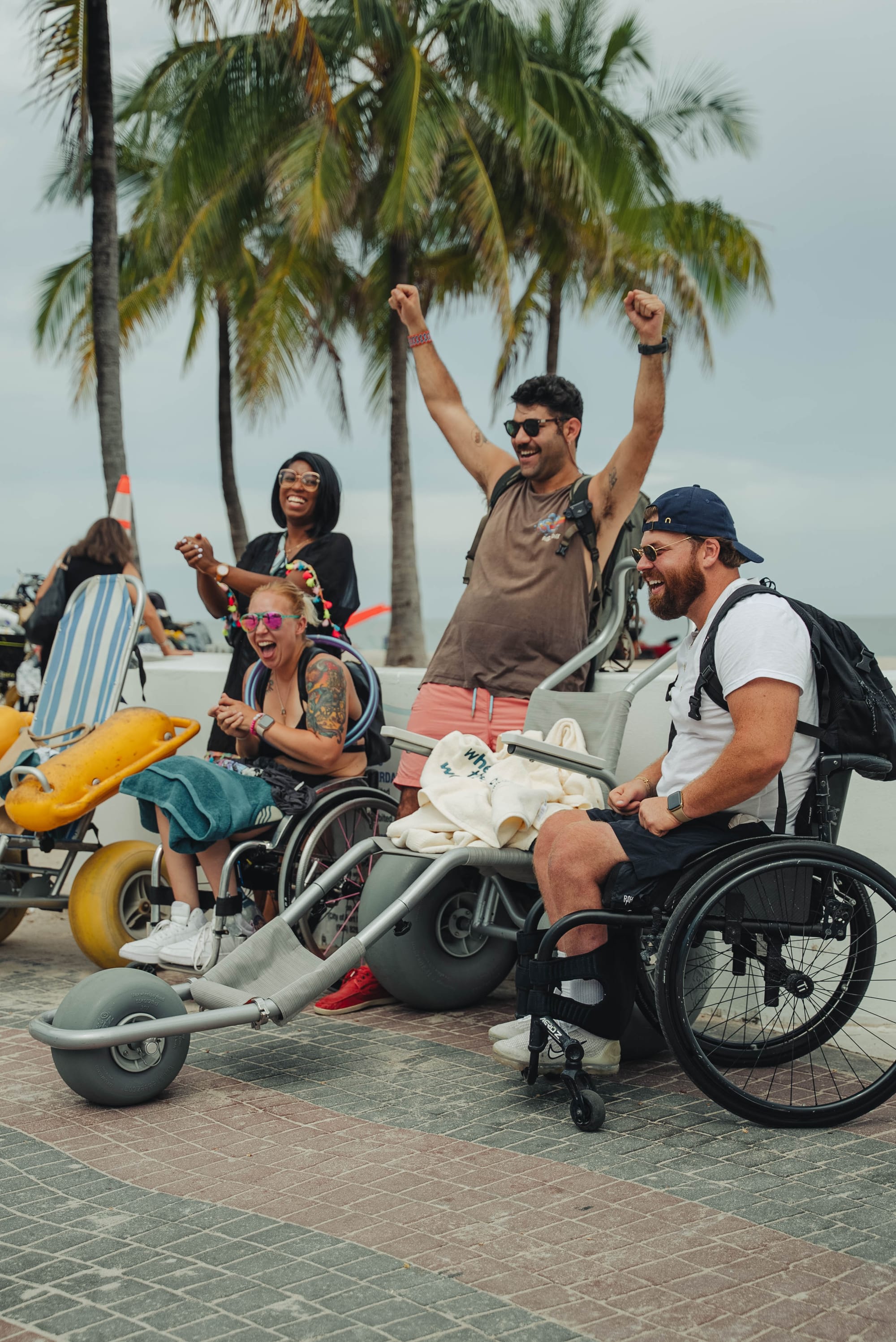 Two wheelchair users and companions enjoying an accessible trip in Fort Lauderdale, Florida