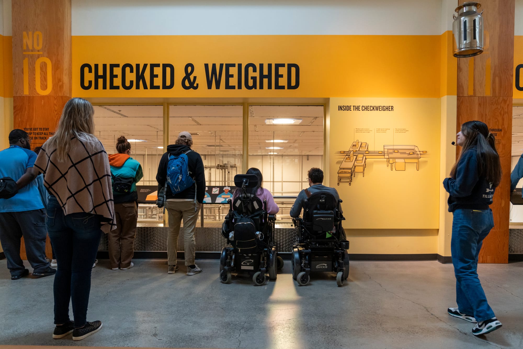 Two wheelchair users on a tour of the Tillamook Creamery