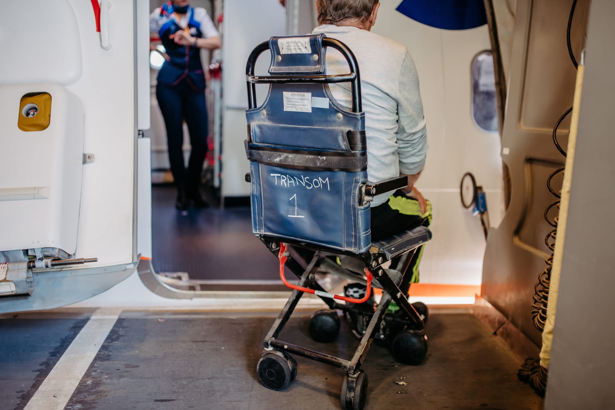 Aisle wheelchair for transferring onboard and aircraft