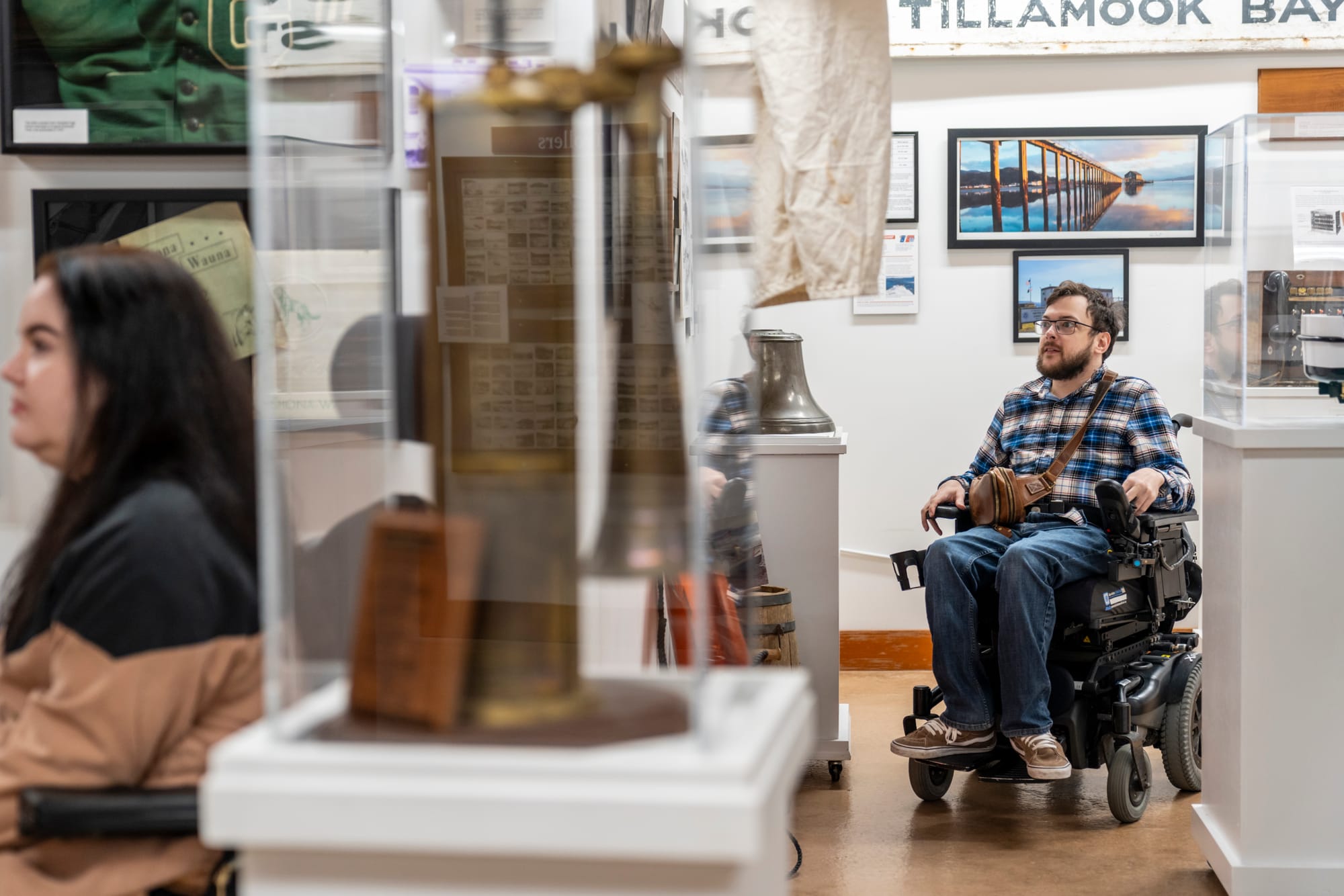 Wheelchair user looking at exhibits at Garibaldi Maritime Museum, Tillamook Coast