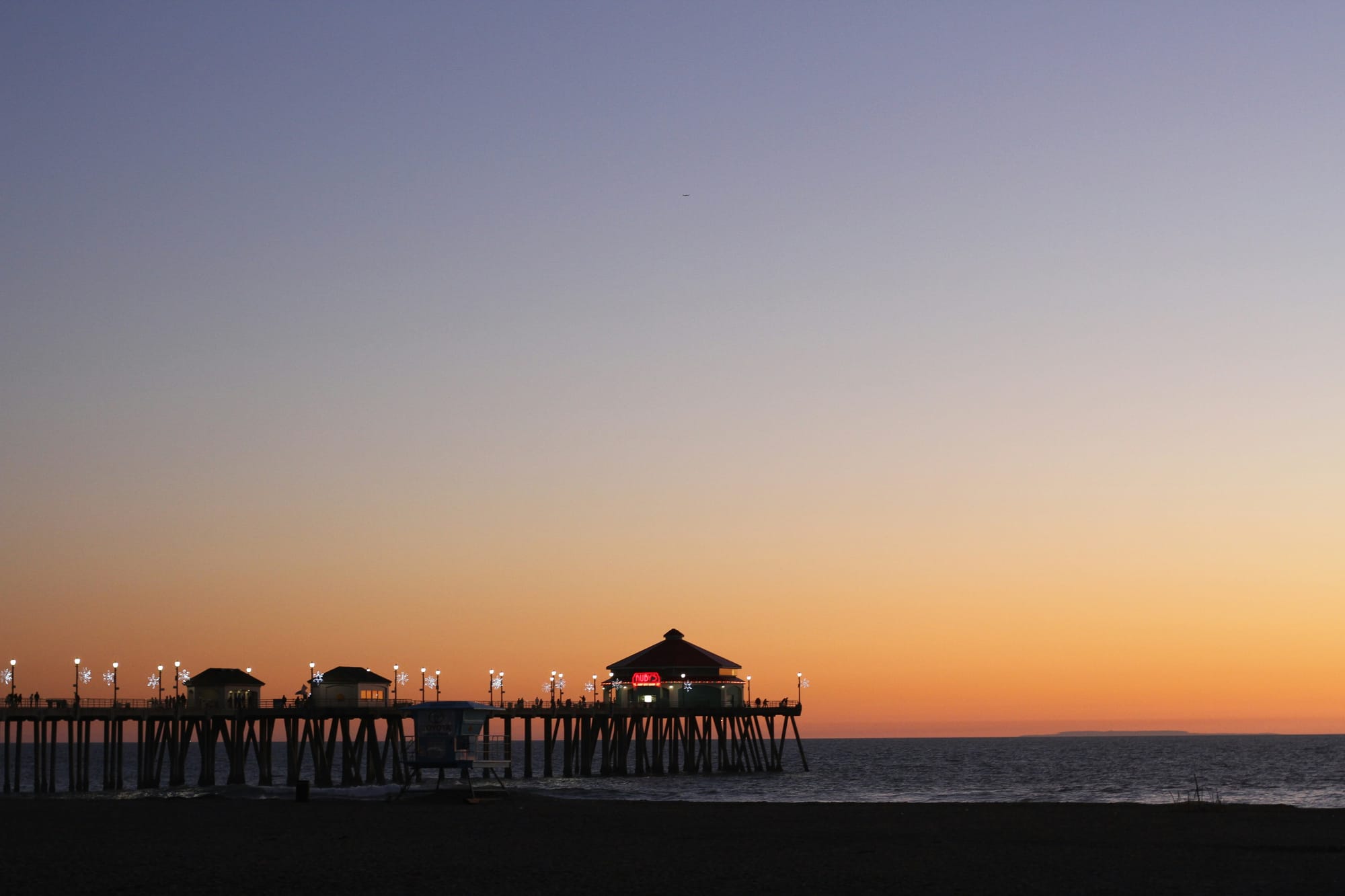 Silhouette of Hunting Beach Pier after sunset