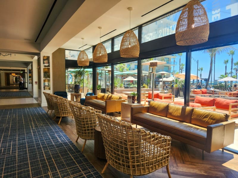 Dining and lounge area at The Waterfront Beach Resort, a Hilton Hotel