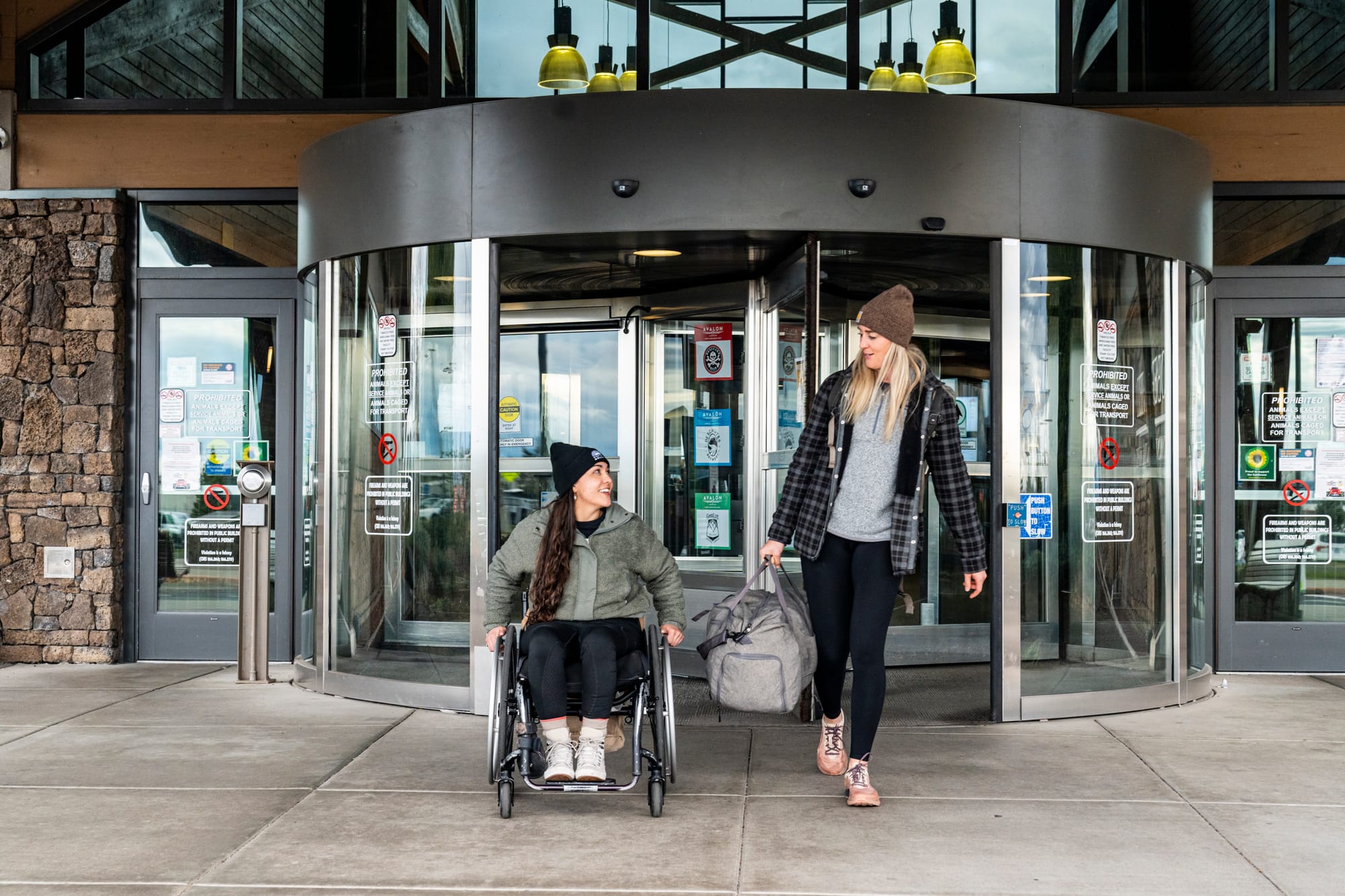 Wheelchair-user and companion leaving the Colorado Springs airport after landing