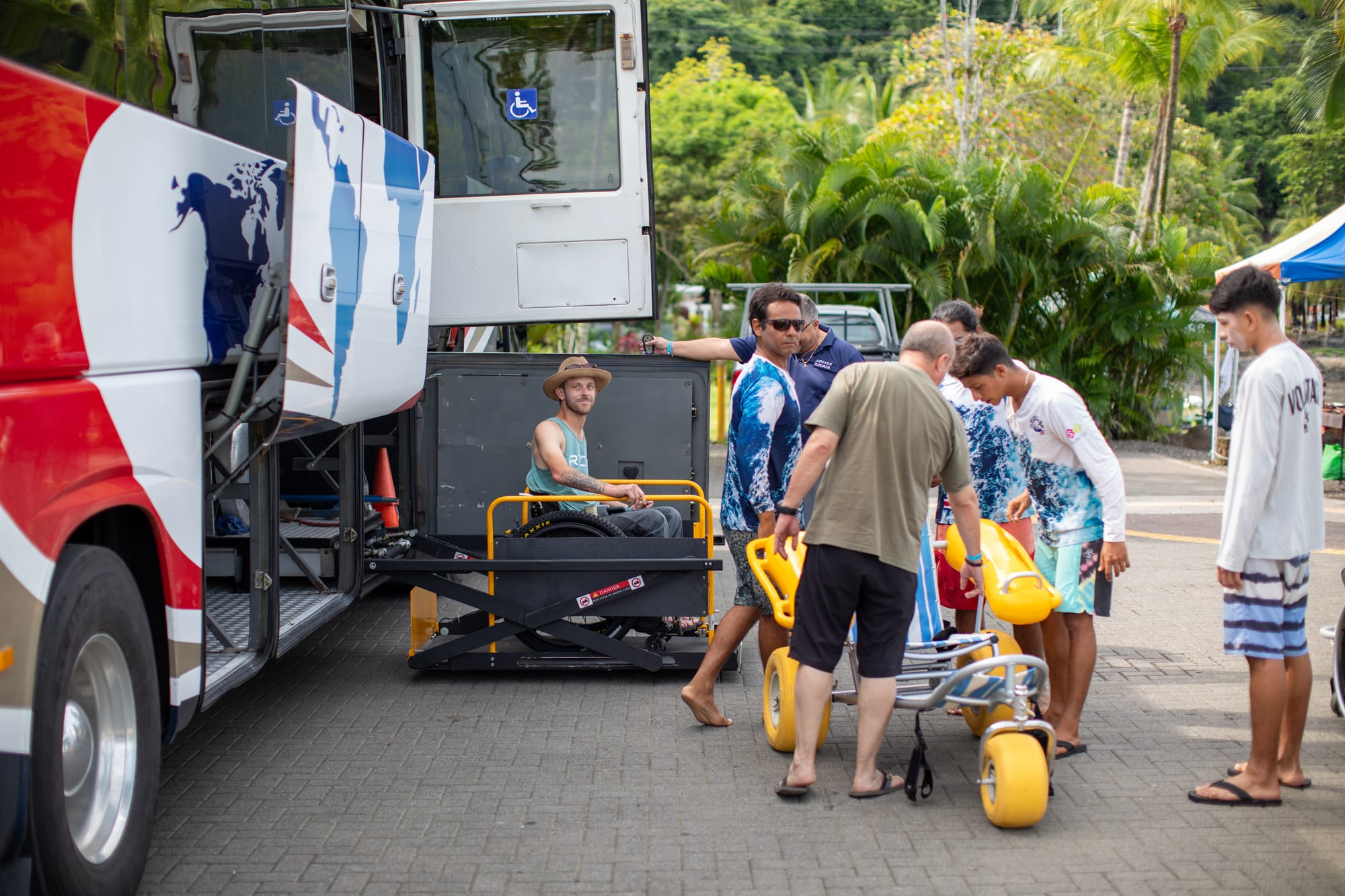 Wheelchair user getting of an adapted bus via ramp in Costa Rica