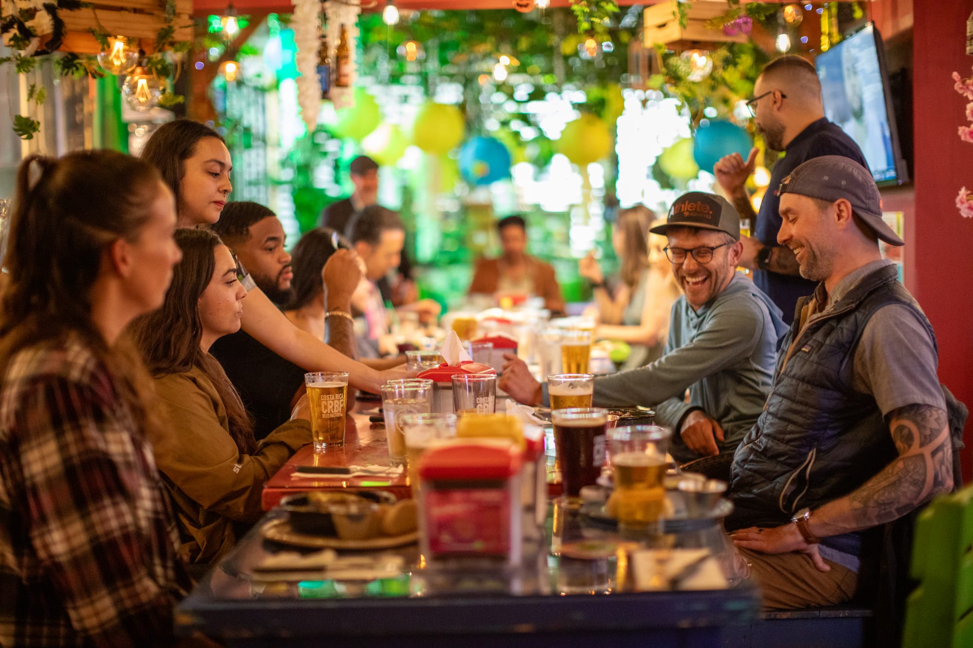 Group travel to Rica, enjoying beers and food