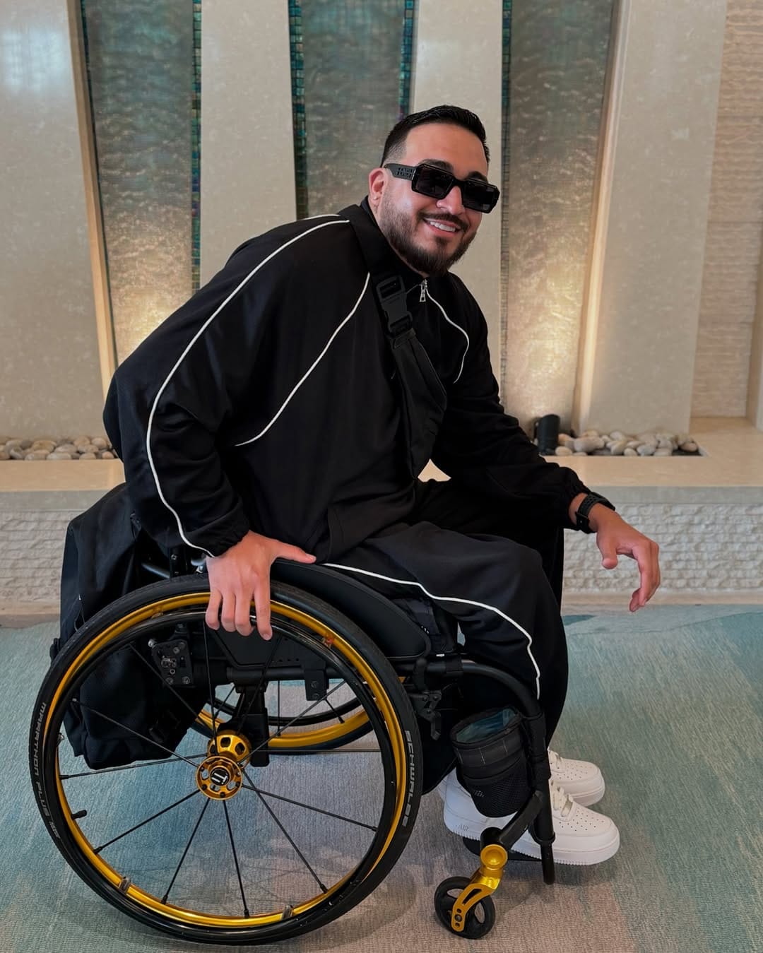 Wheelchair Papi showing his fashion-forward fit