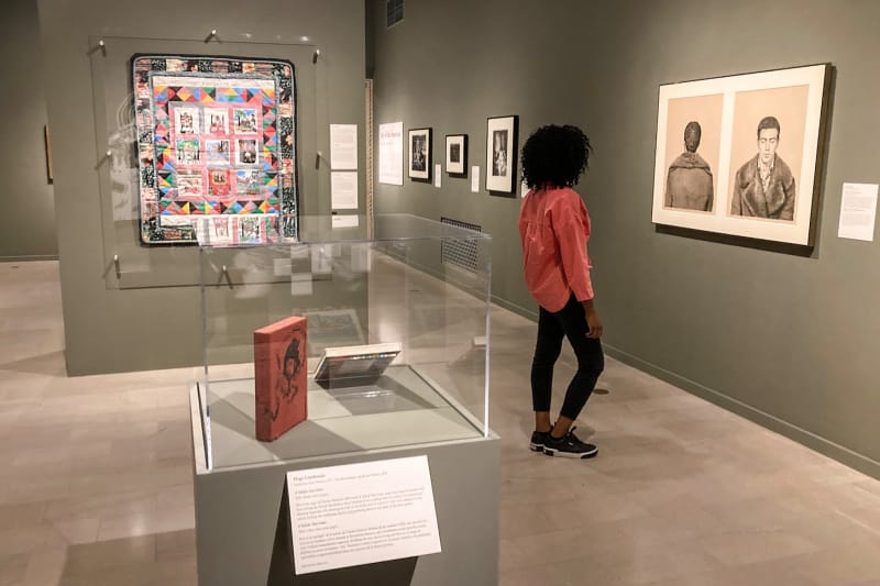 Woman looking at art at The San Diego Museum of Art