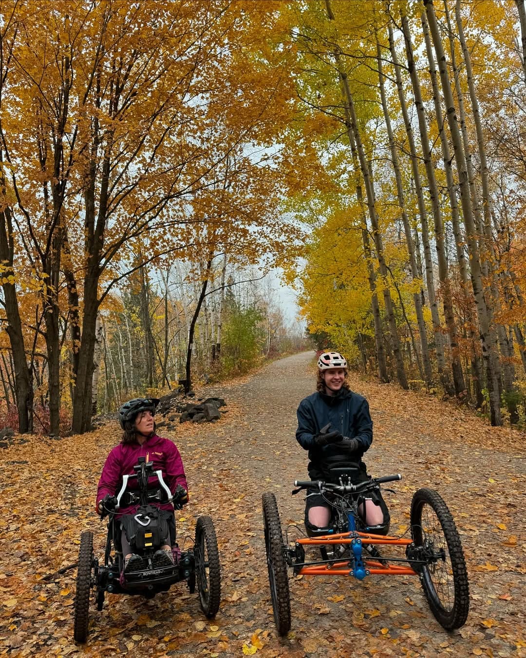 Mason Branstrator and friend enjoying adaptive cycling on accessible trails