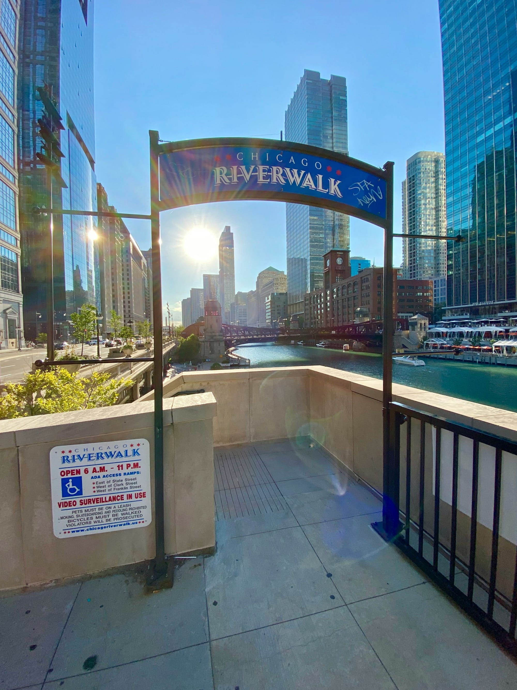 Chicago Riverwalk with a sign for ada access ramps