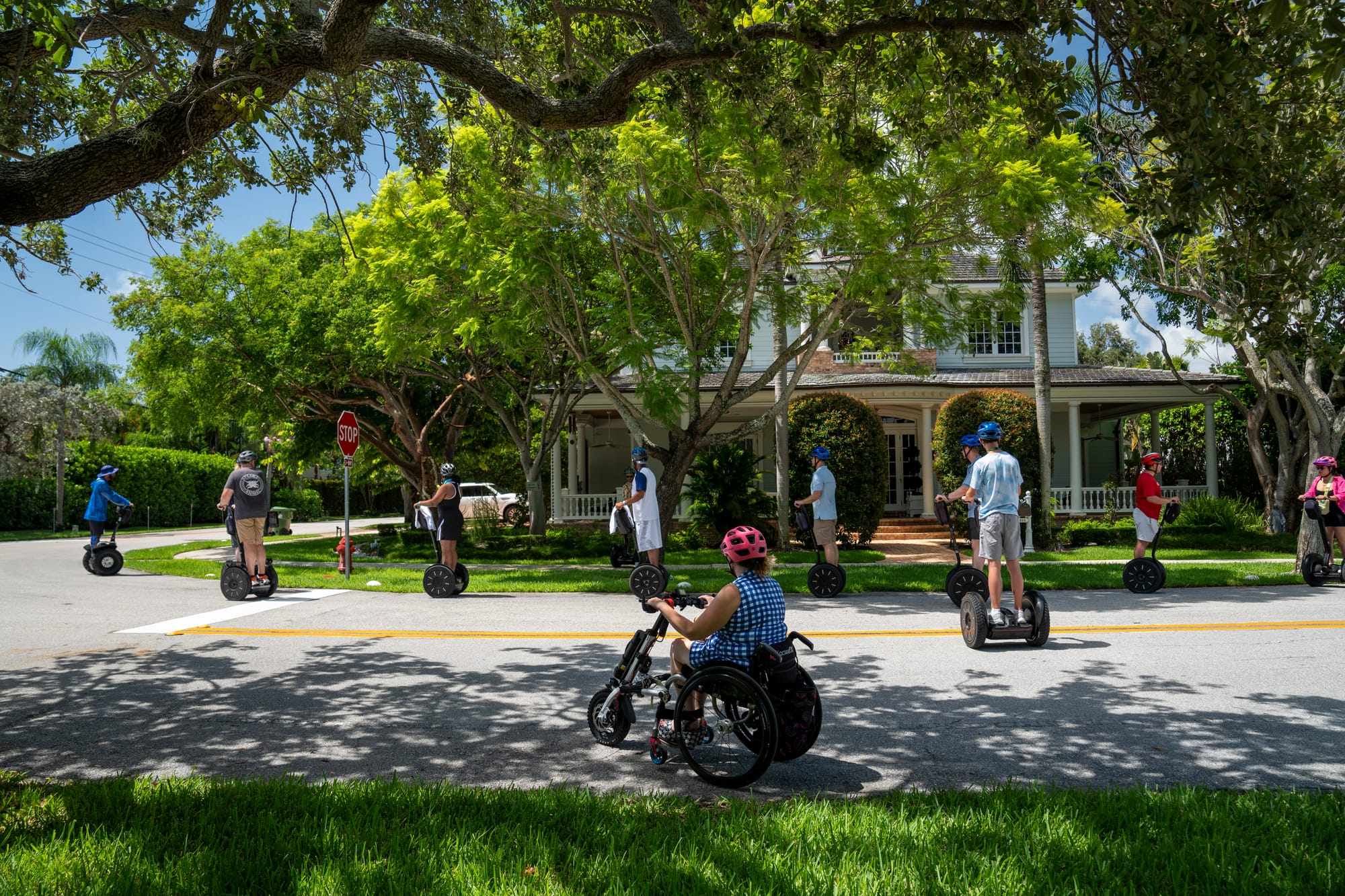 Wheelchair user and family on Segways touring around Fort Lauderdale