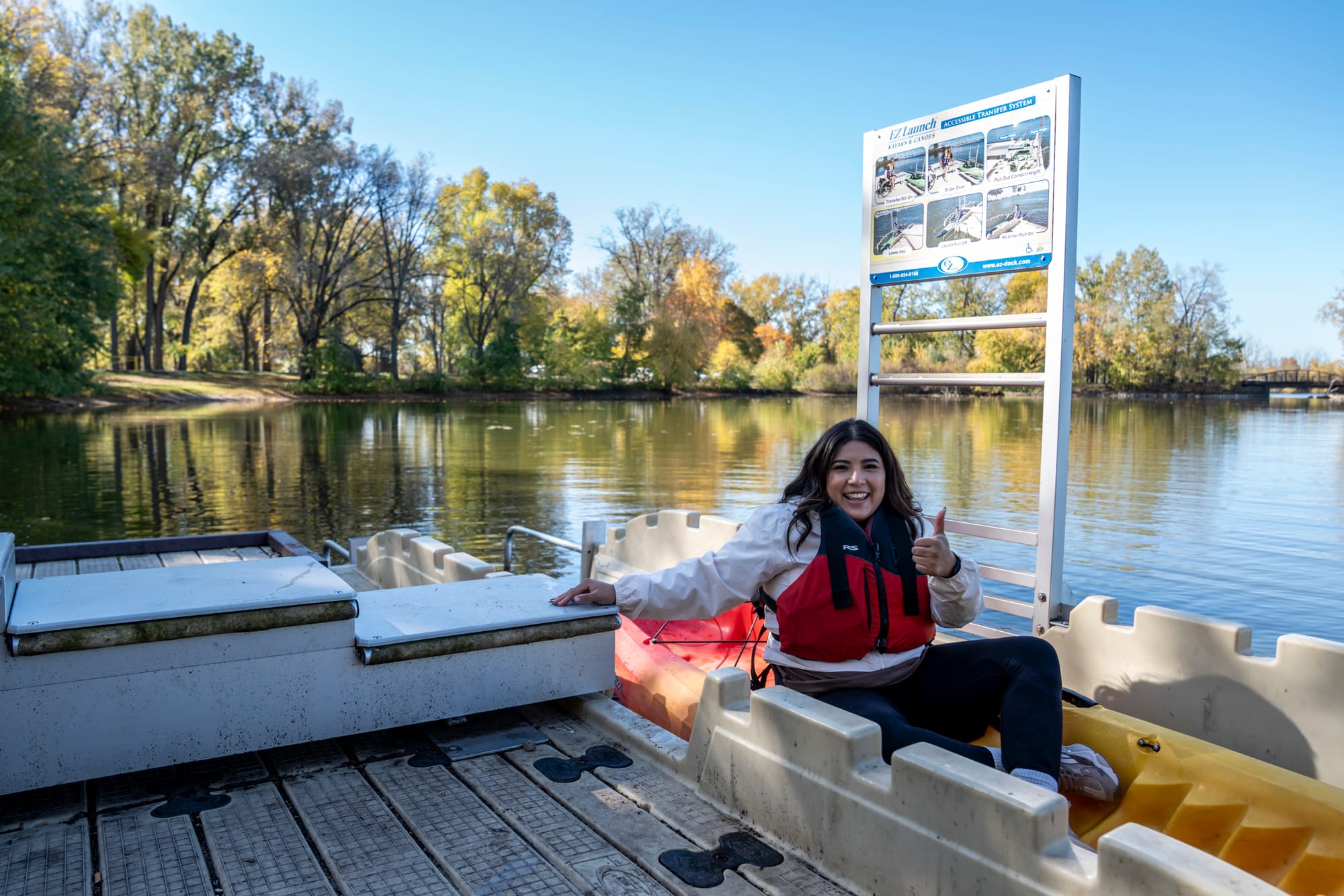 Wheelchair-user using the accessible kayak launch in Grand Rapids