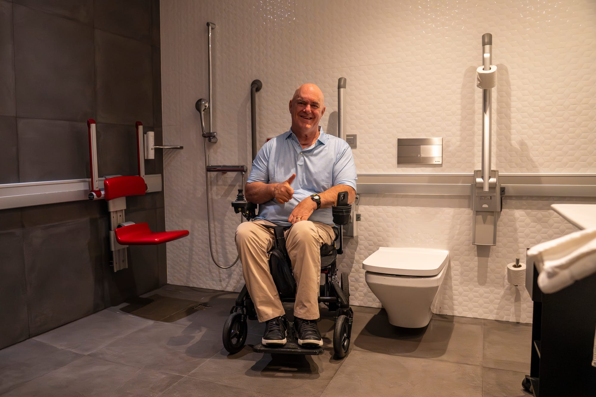 Wheelchair user in the accessible bathroom at Ilunion Atrium Madrid