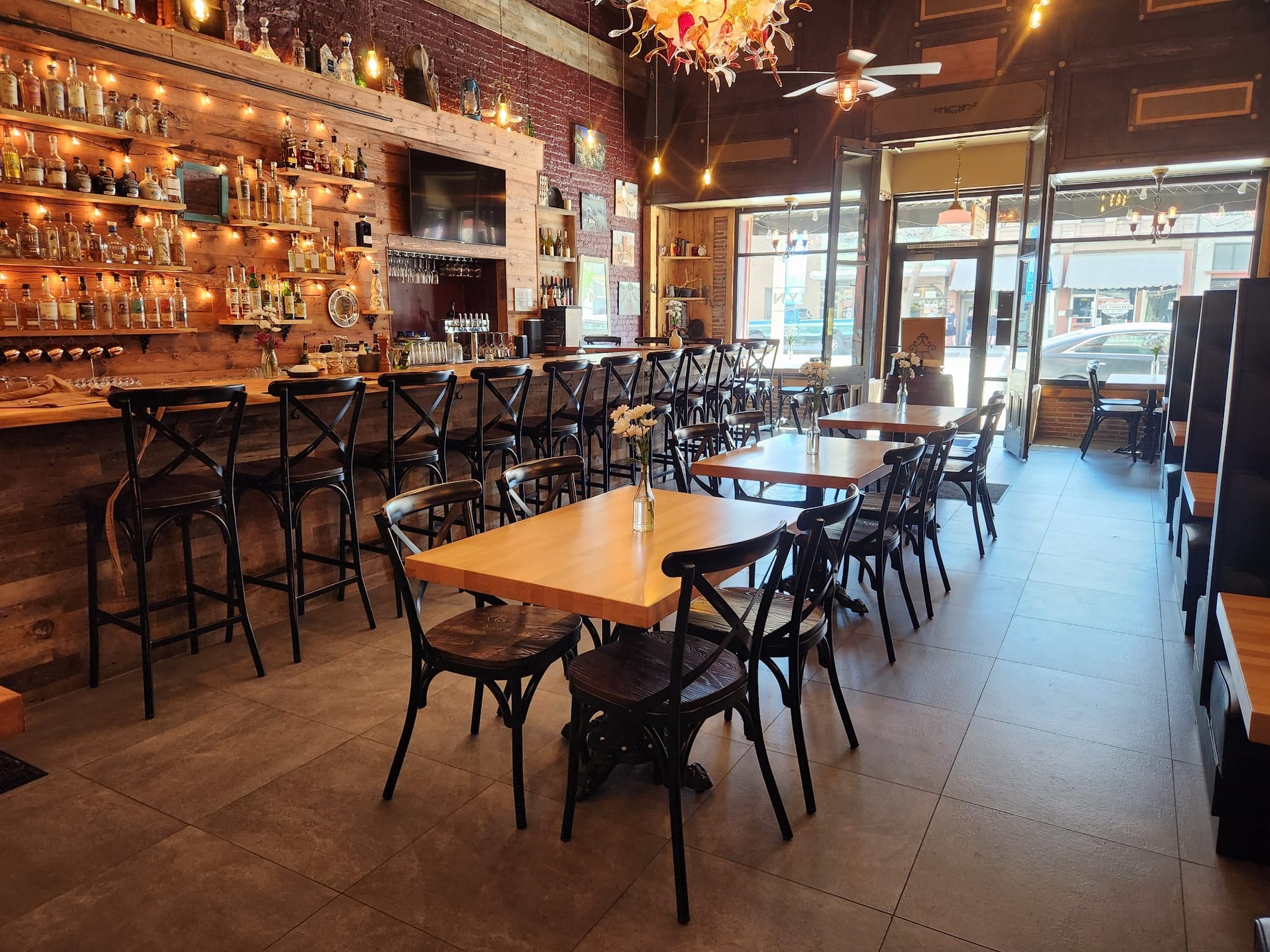Tables and bar inside of The Cabyn Cocktail Bar & Kitchen