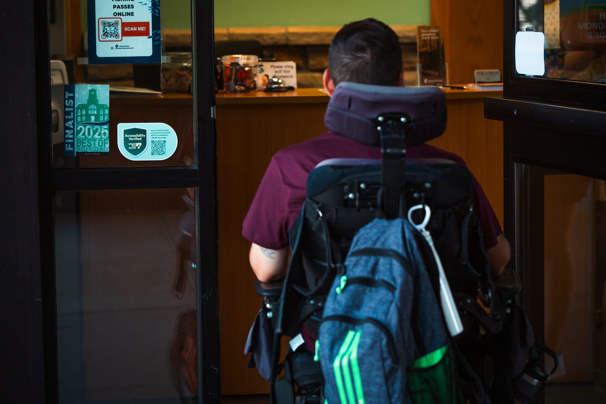 Wheelchair user enters an accessibility verified business in Butler County, OH