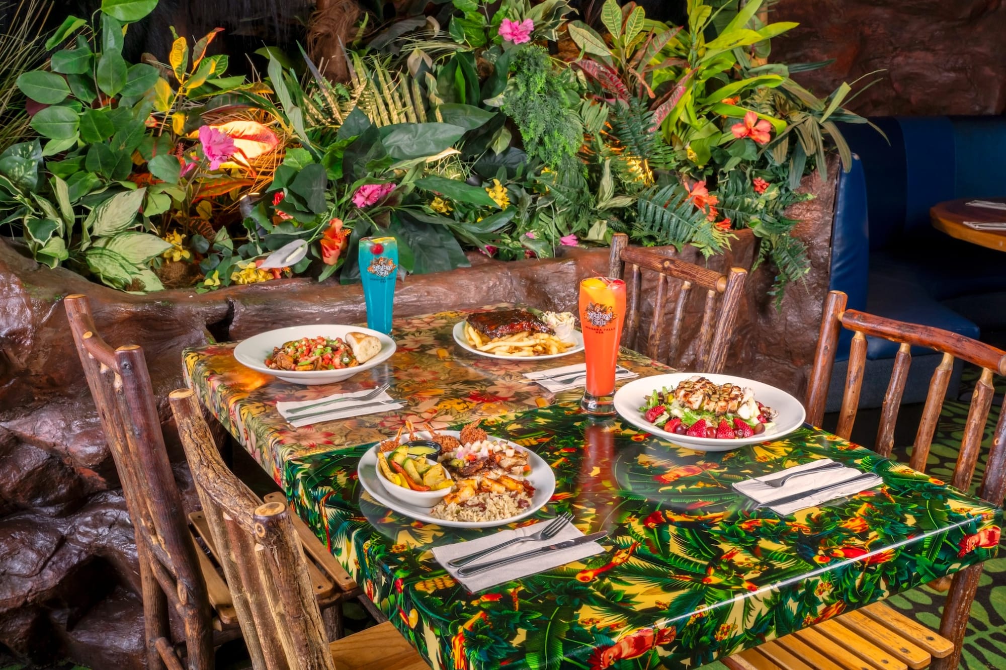 4 meals on a dining table at Rainforest Cafe