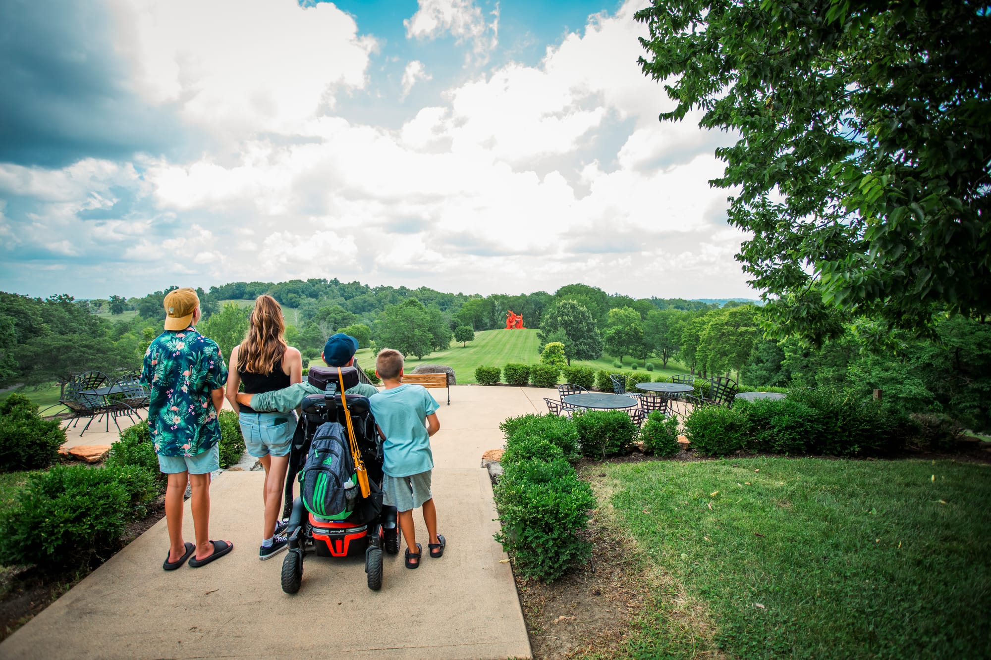Wheelchair user and family looking out over Pyramid Hill Sculpture Park