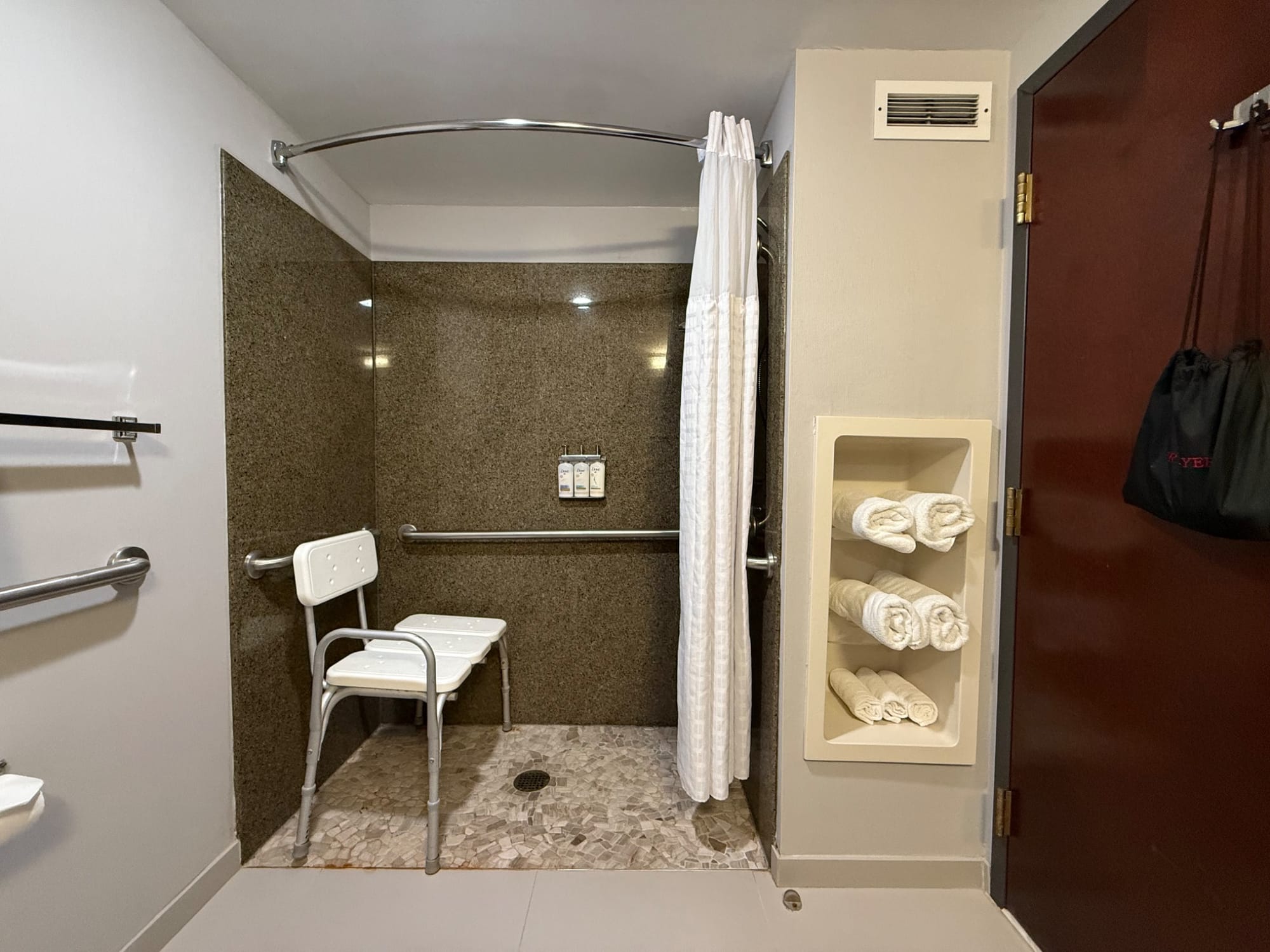 Roll-in shower, seat and grab bars at at Holiday Inn Express & Suites in Cooperstown, NY