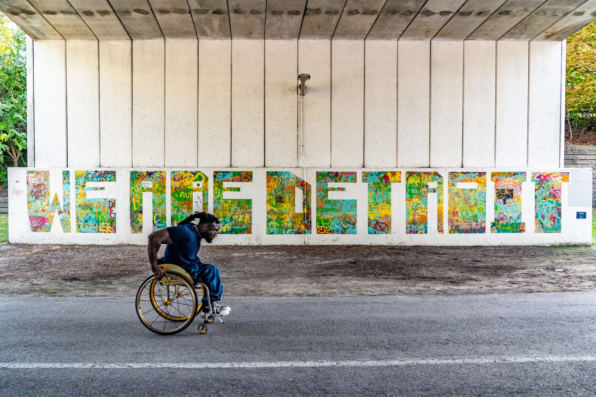Matt, wheelchair user, strolling Dequindre Cut in Detroit