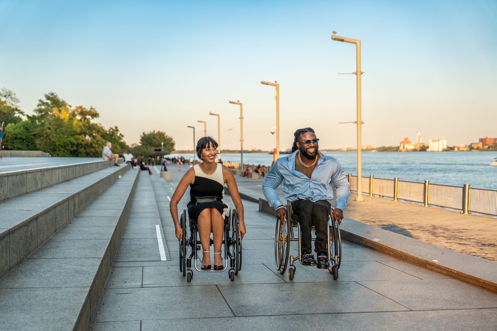 Matt Scott and Kaylee Bays, two wheelchair users, on the Detroit Riverwalk