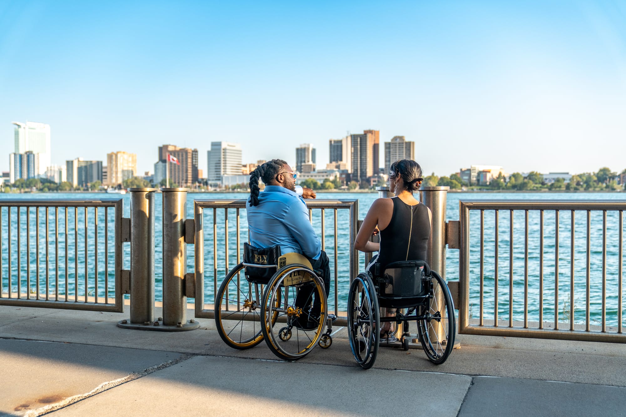 Matt Scott and Kaylee Bays, two wheelchair users on the Detroit Riverwalk