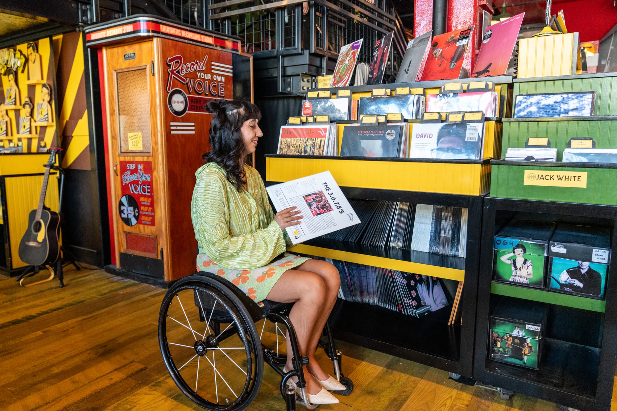 Kaylee Bays, wheelchair user, checking out a record at Third Man Records