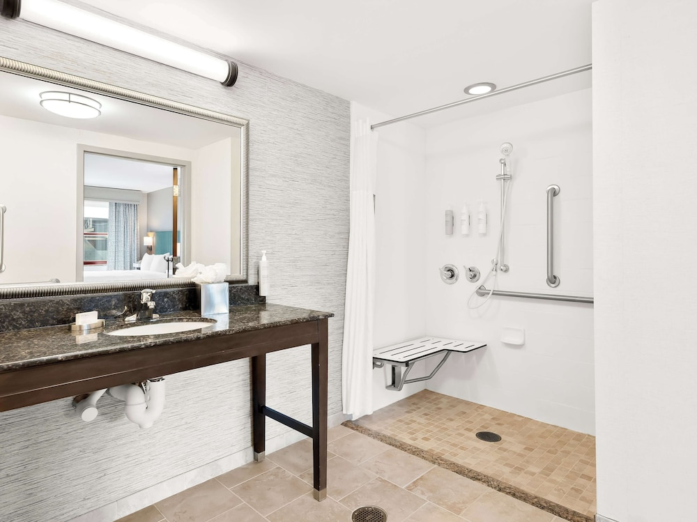 Roll-in shower, seat, and grab bars at Hampton Inn & Suites Lake Placid