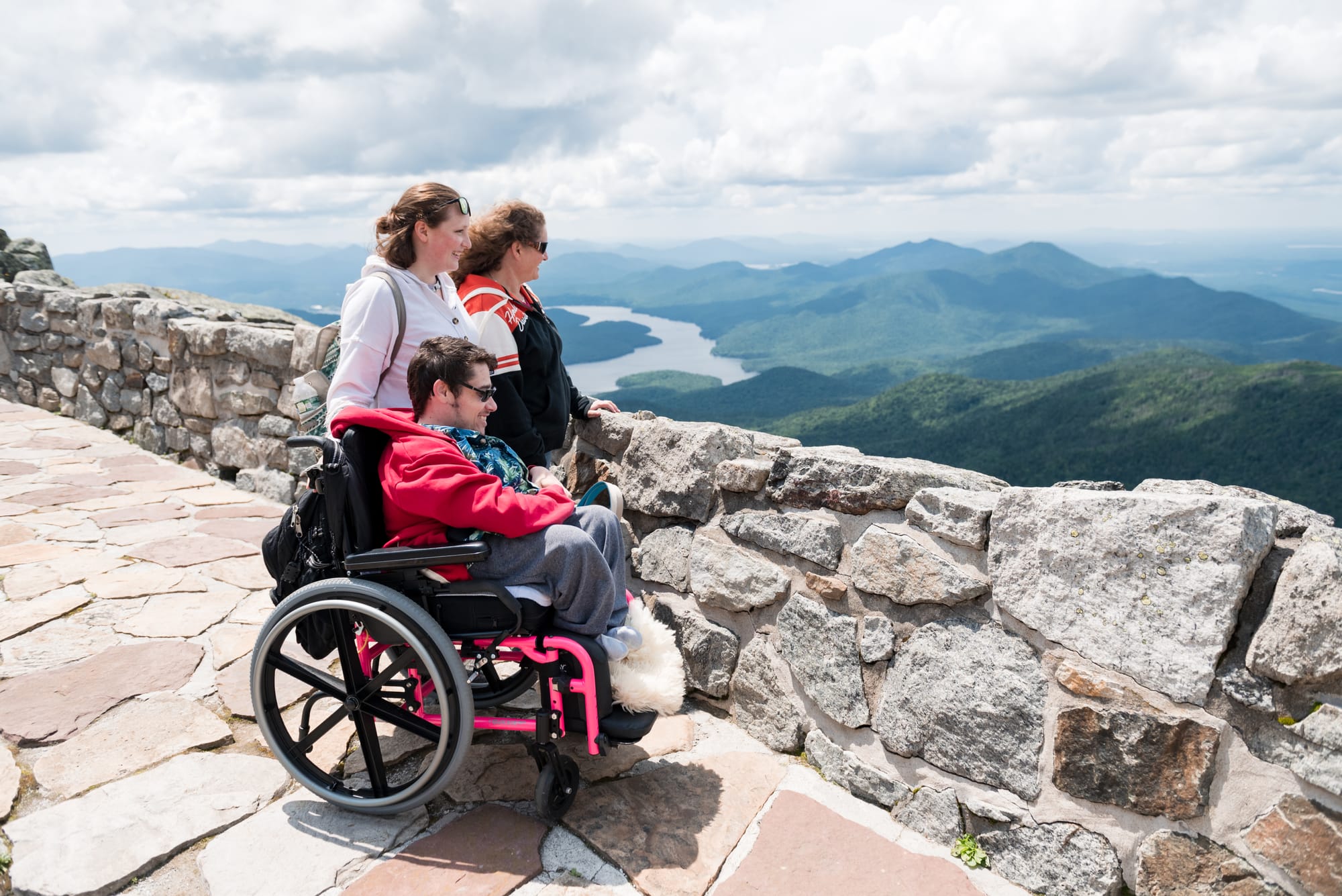 Wheelchair user and companions at the overlook on the Veterans’ Memorial Highway