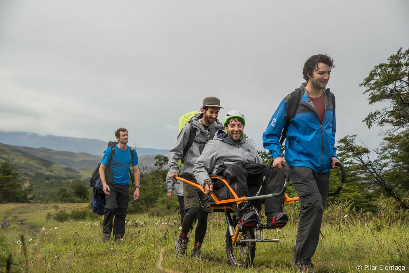 Alvaro, wheelchair user, and companions trekking Torres del Paine