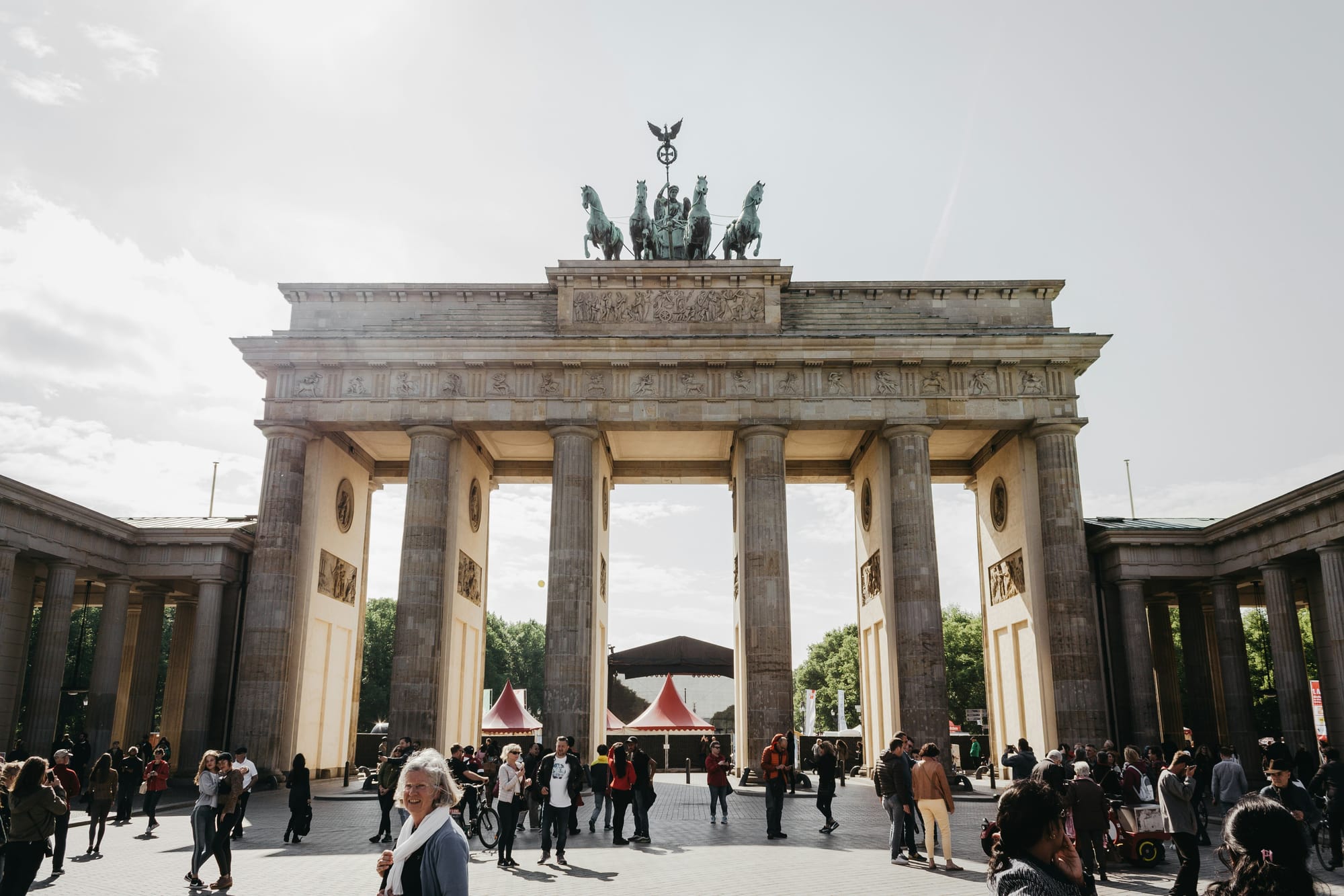 Brandenburg Gate with many people walking around