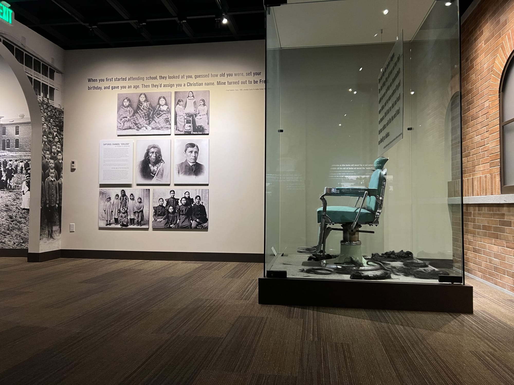 Exhibits at Heard Museum in Scottsdale, including an old chair and photos with text