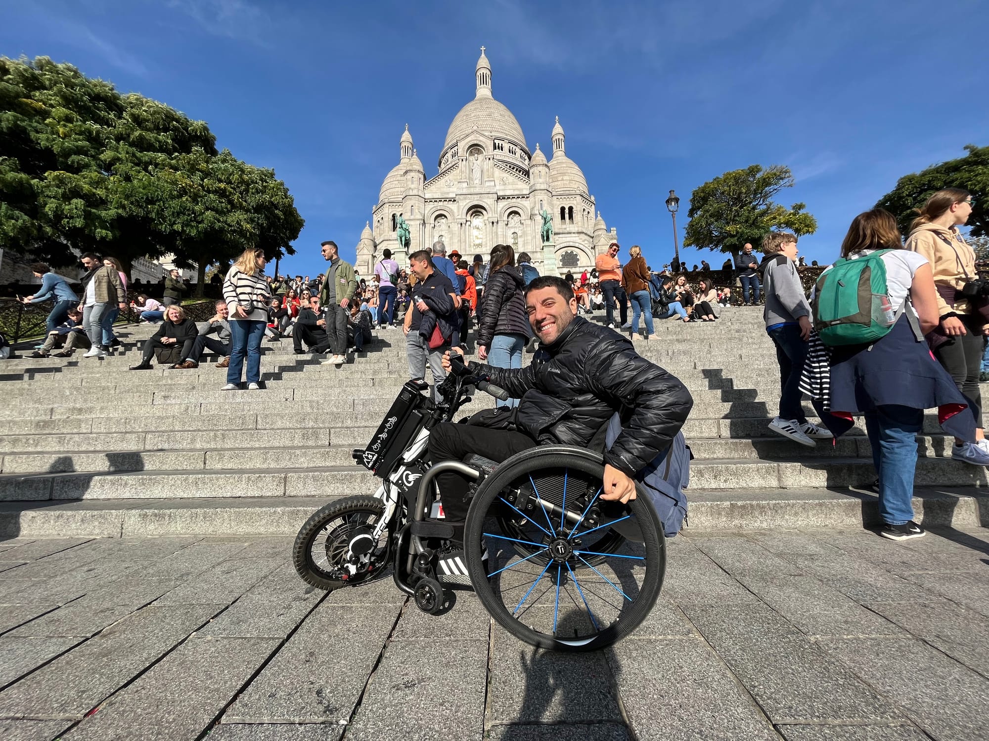 Wheelchair user in front of Sacré-Cœur Basilica in Paris
