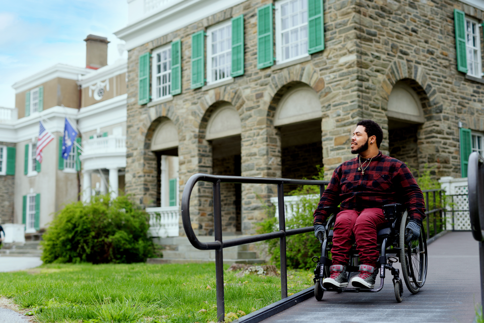 Wheelchair user going down an accessible ramp in Dutchess County, New York