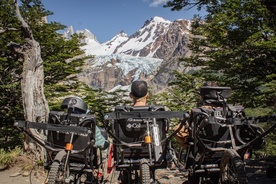 Three wheelchair-users enjoying the views of Patagonia during their hike