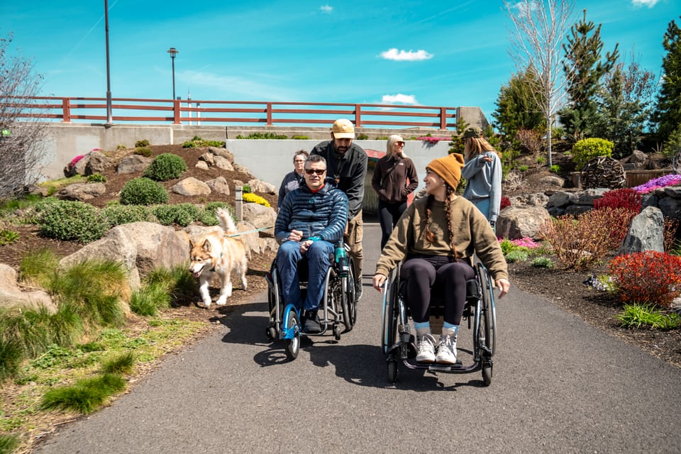 Wheelchair-user on an accessible river trail in Central Oregon